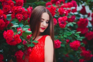 Girl in a red dress with red flowers 
